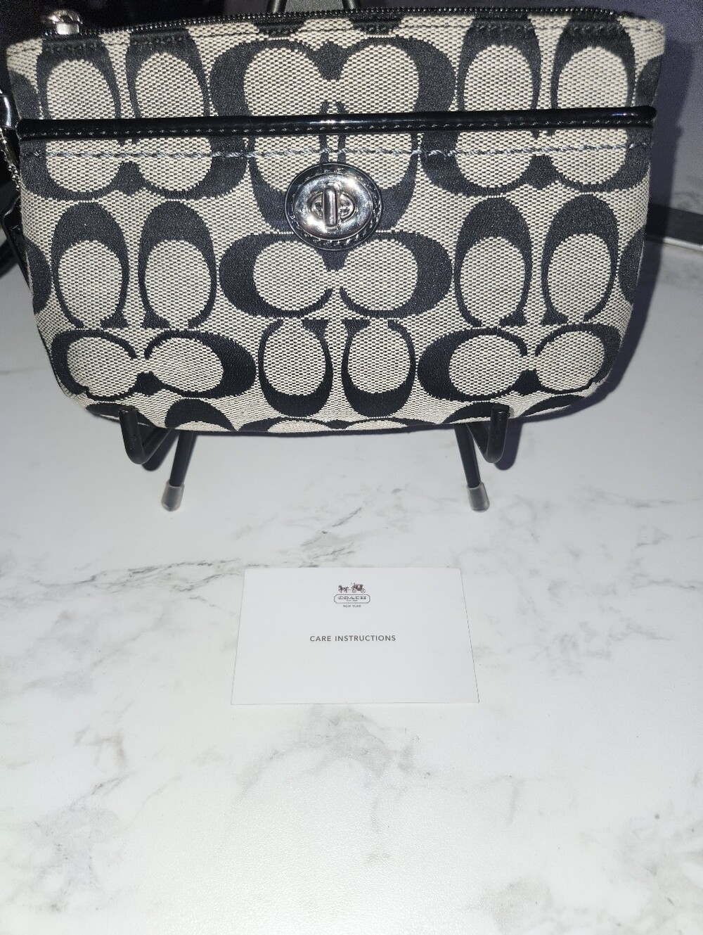 Coach Monogram Signature Turnlock Wristlet
